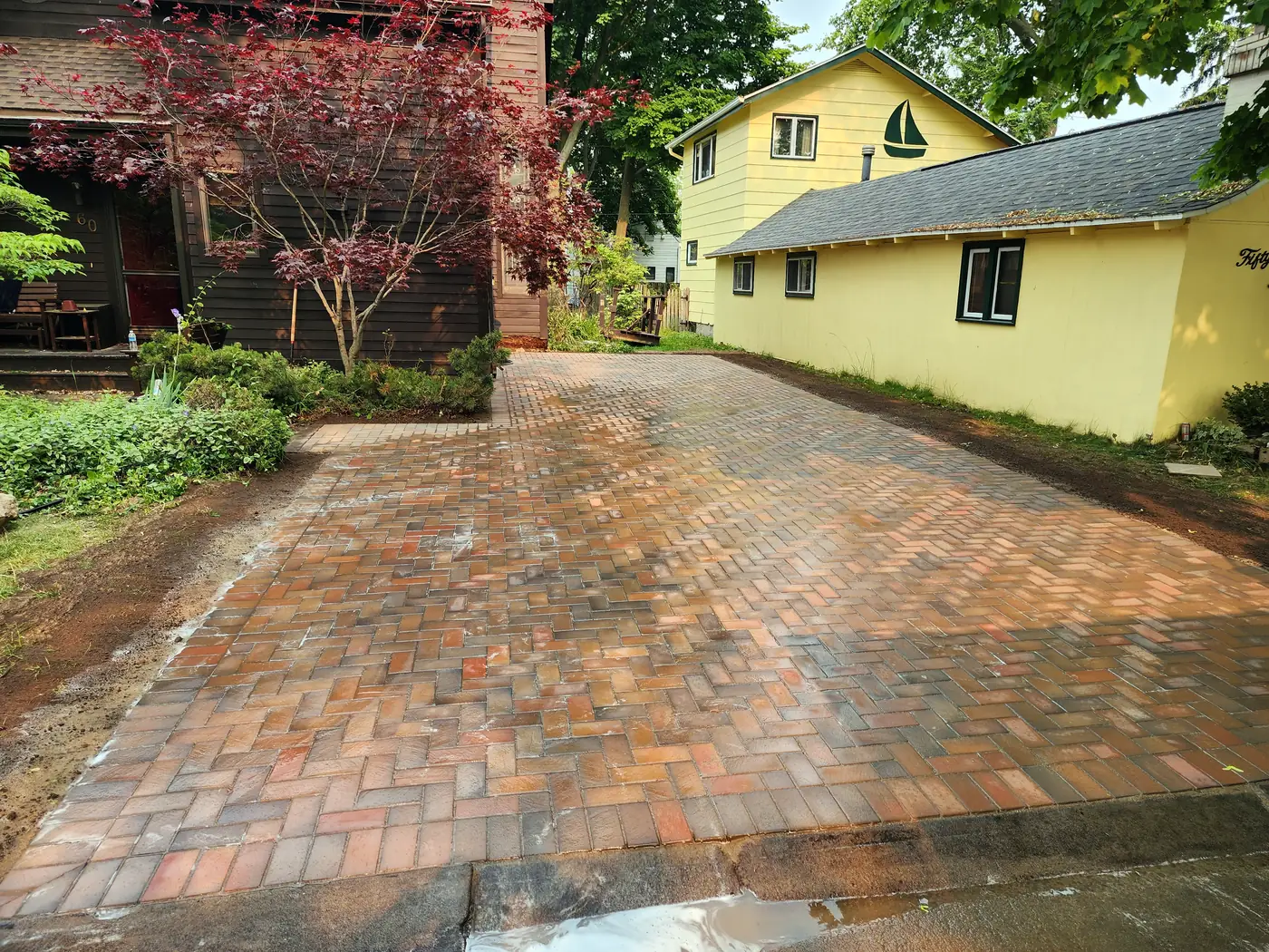 Finished herringbone brick paver driveway